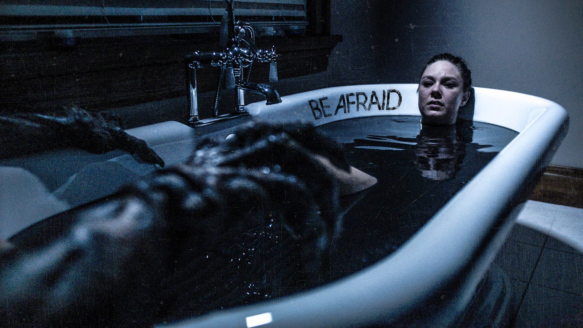 Jaimi Paige takes a bath as one of he creatures advance on her in Be Afraid (2017)