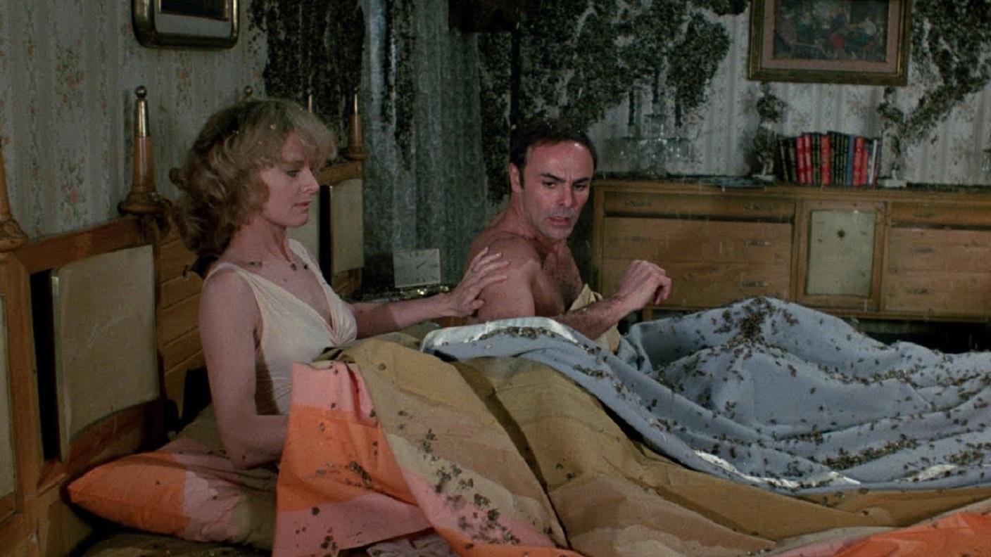 Angel Tompkins and John Saxon wake up in a bed covered in bees in The Bees (1978)