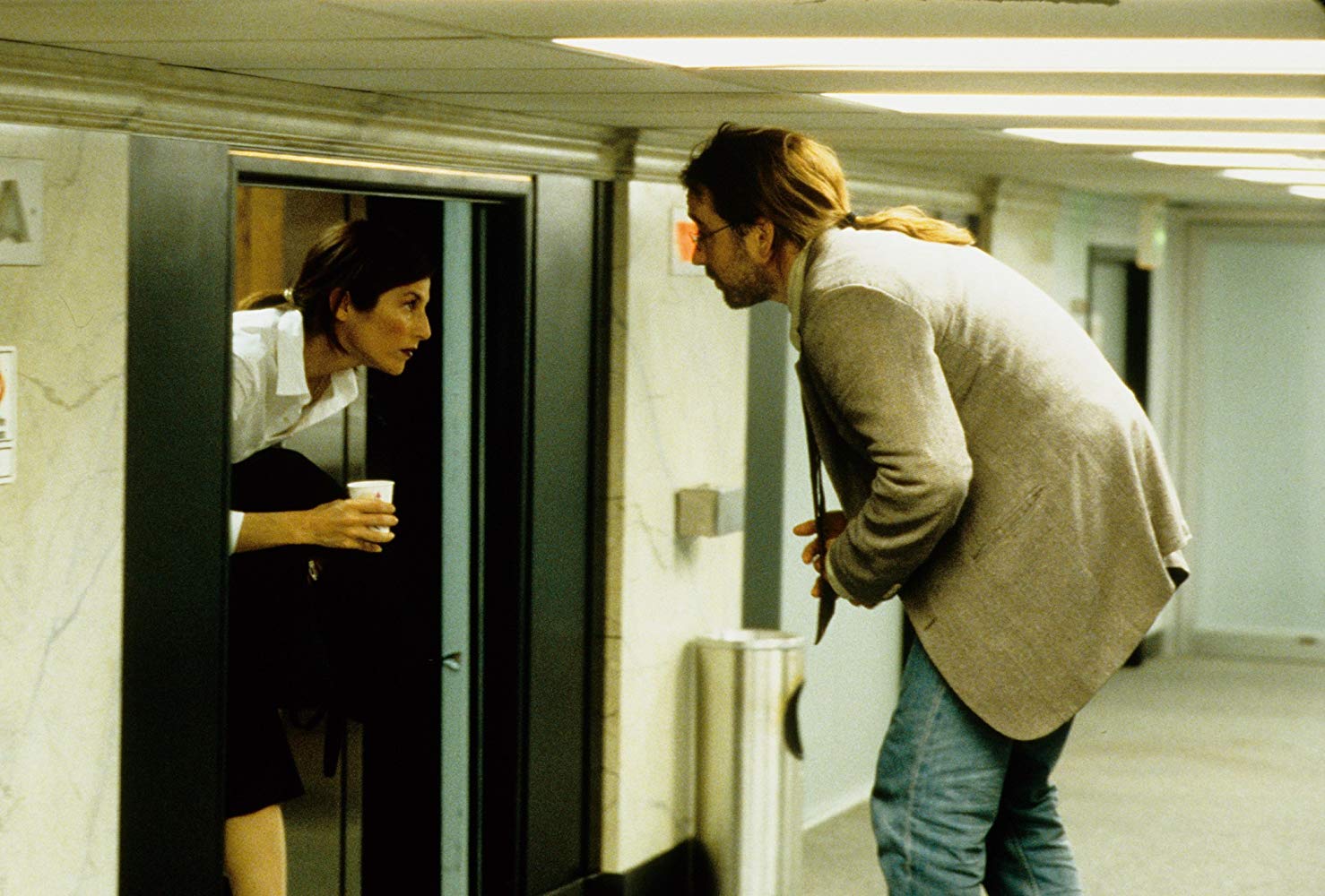 John Cusack and co-worker Catherine Keener in their workplace on the on the 7½th Floor in Being John Malkovich (1999)