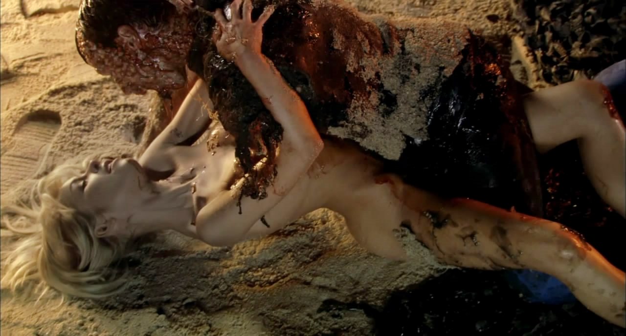 Pilar Soto attacked by her zombified boyfriend in Beneath Still Waters (2005)