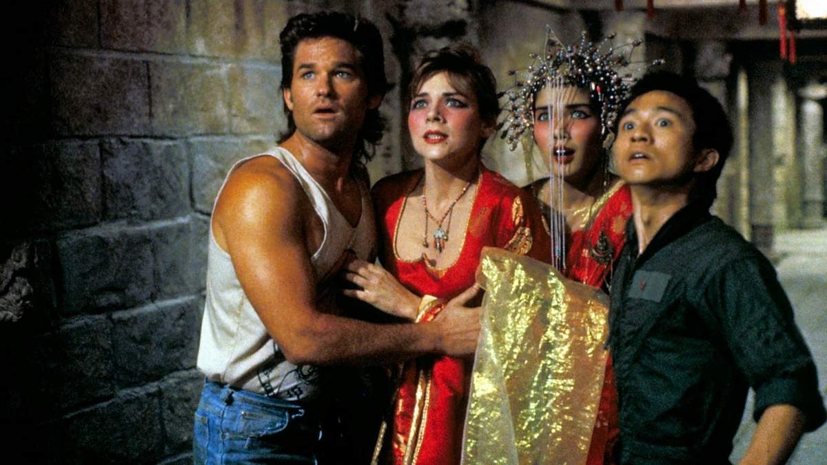 Jack Burton (Kurt Russell) with Gracie Law (Kim Cattrall), and Jack's friend Wang Chi (Dennis Dun) with his green-eyed bride (Suzee Pai) in Big Trouble in Little China (1986)