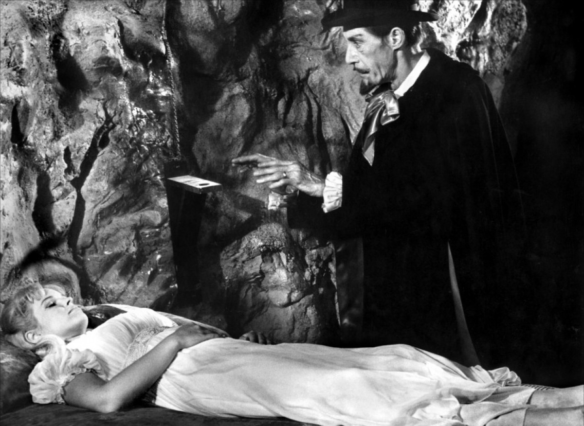 Dracula (John Carradine) approaches a sleeping Melinda Plowman in Billy the Kid Versus Dracula (1966)