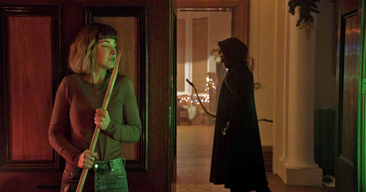 Imogen Poots hides from the killer in Black Christmas (2019)