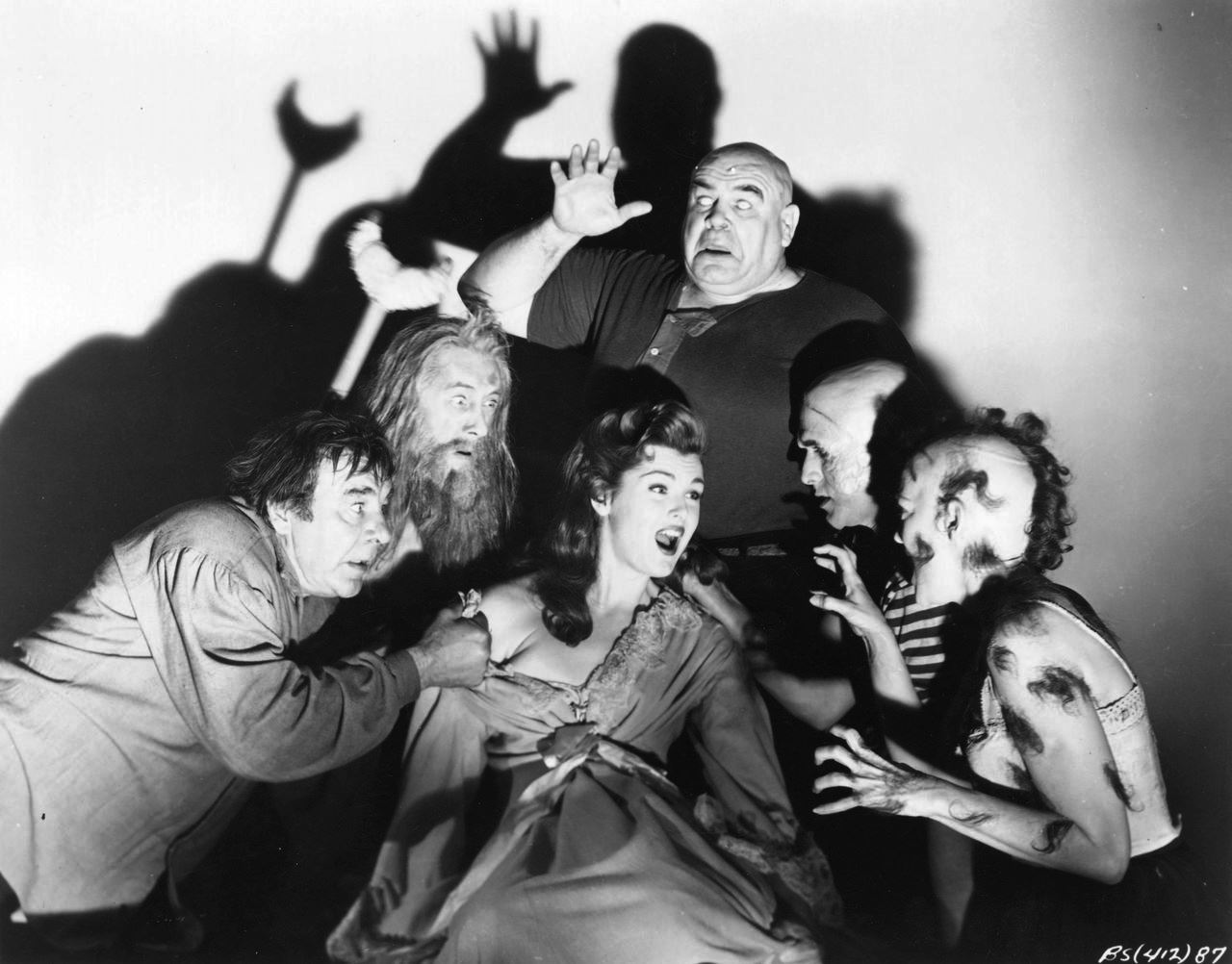 The deformities crowd in around Patricia Blake - (clockwise from left) Lon Chaney Jr, John Carradine, Tor Johnson, George Sawaya and Claire Carleton in The Black Sleep (1956)