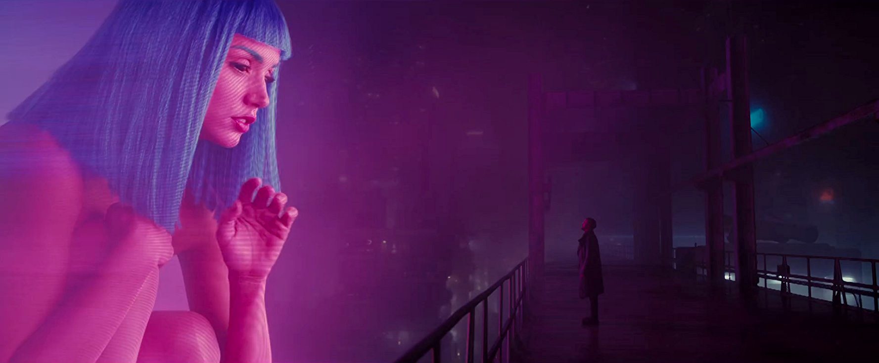 Ryan Gosling greeted by a giant-sized hologram in Blade Runner 2049 (2017)