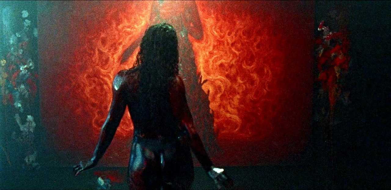 A blood-drenched Dora Madison sets out to complete her painting in Bliss (2019)