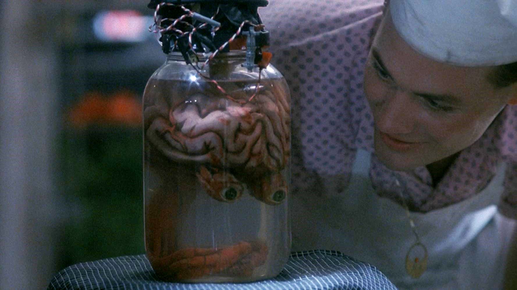 Rick Burks with the brain of Uncle Aylmer in Blood Diner (1987)