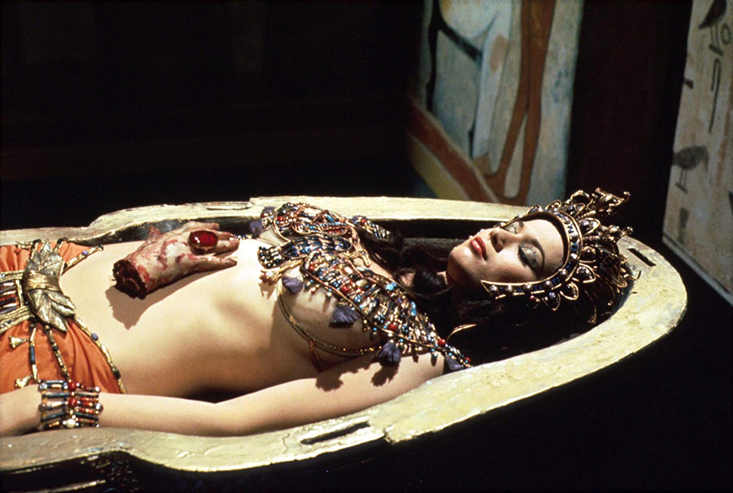 Valerie Leon as Queen Tera with severed hand in Blood from the Mummy's Tomb (1971)