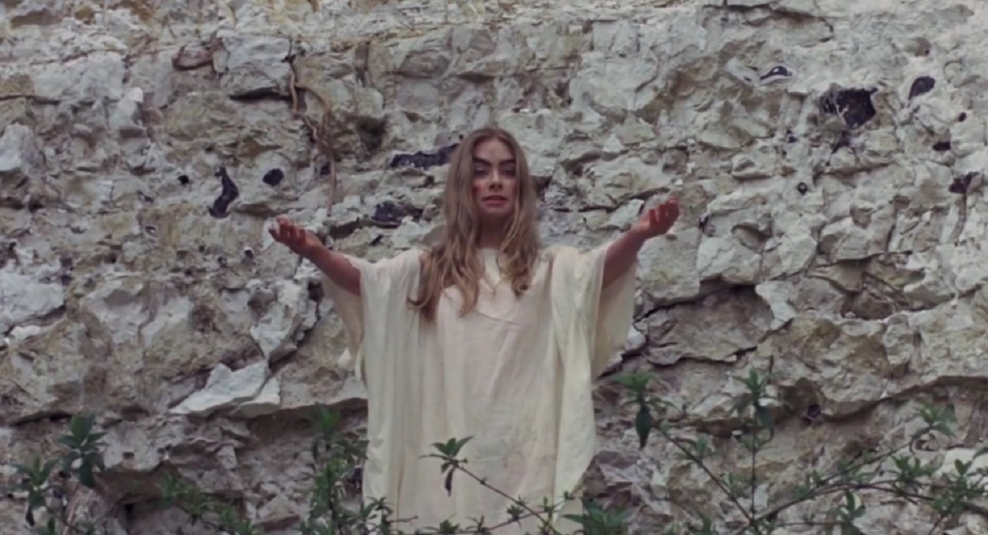 Angel Blake (Linda Hayden) leads the children in Satanic rituals in Blood on Satan's Claw (1971)