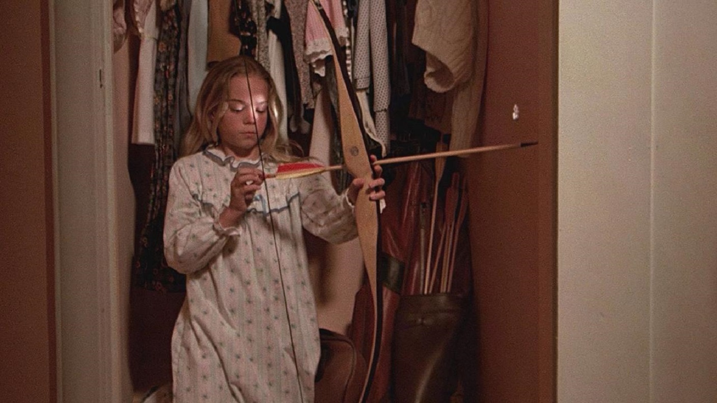 Elizabeth Hoy wields bow and arrow in Bloody Birthday (1981)