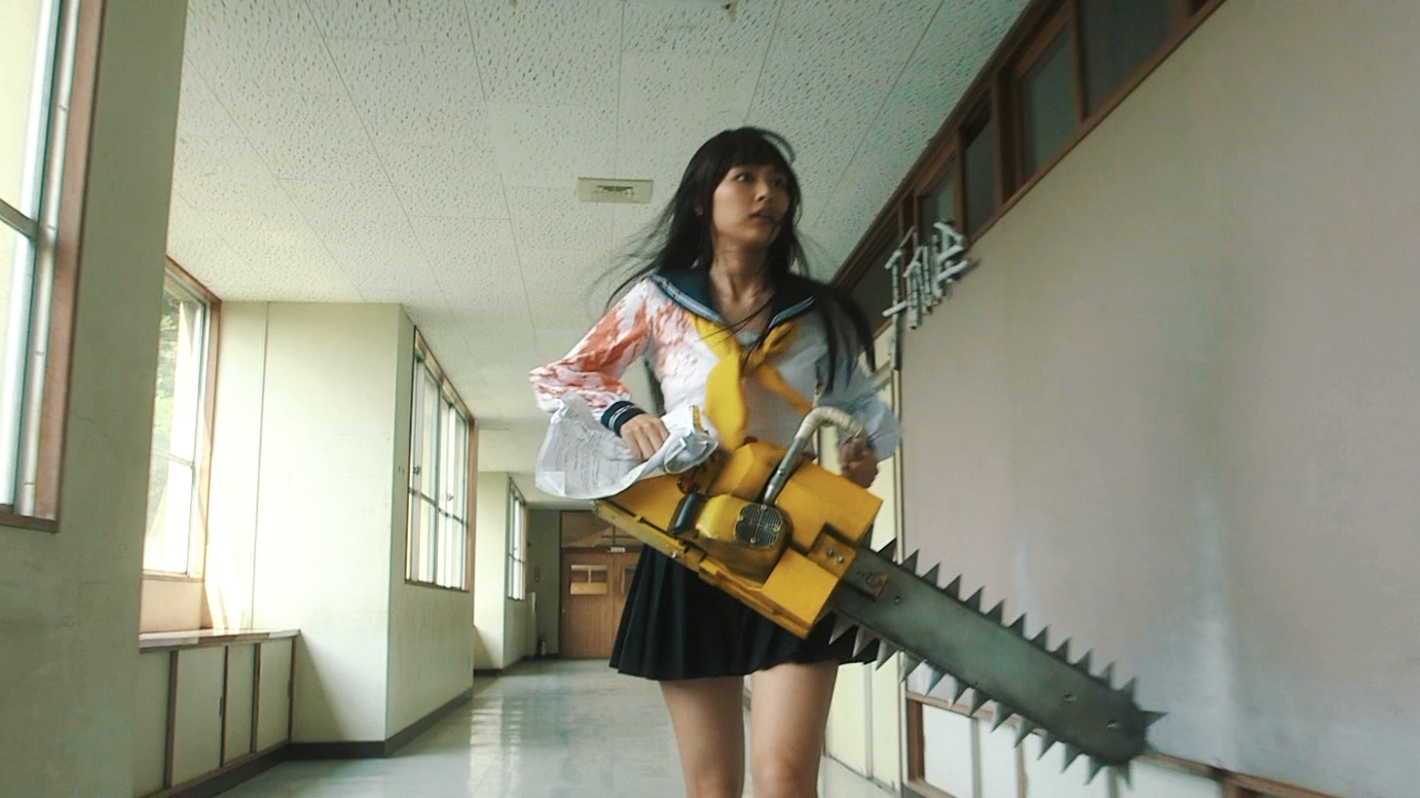 Rio Uxhida and chainsaw on her way to class in Bloody Chainsa Girl (2016)