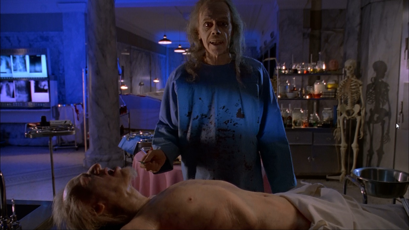 Director John Carpenter as the pun-cracking coroner and narrator in Body Bags (1993)