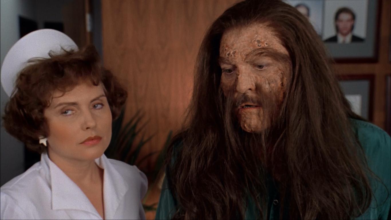 Stacy Keach finds that his hair will not stop growing. Accompanied by his nurse, played by pop singer Deborah Harry in Body Bags (1993)