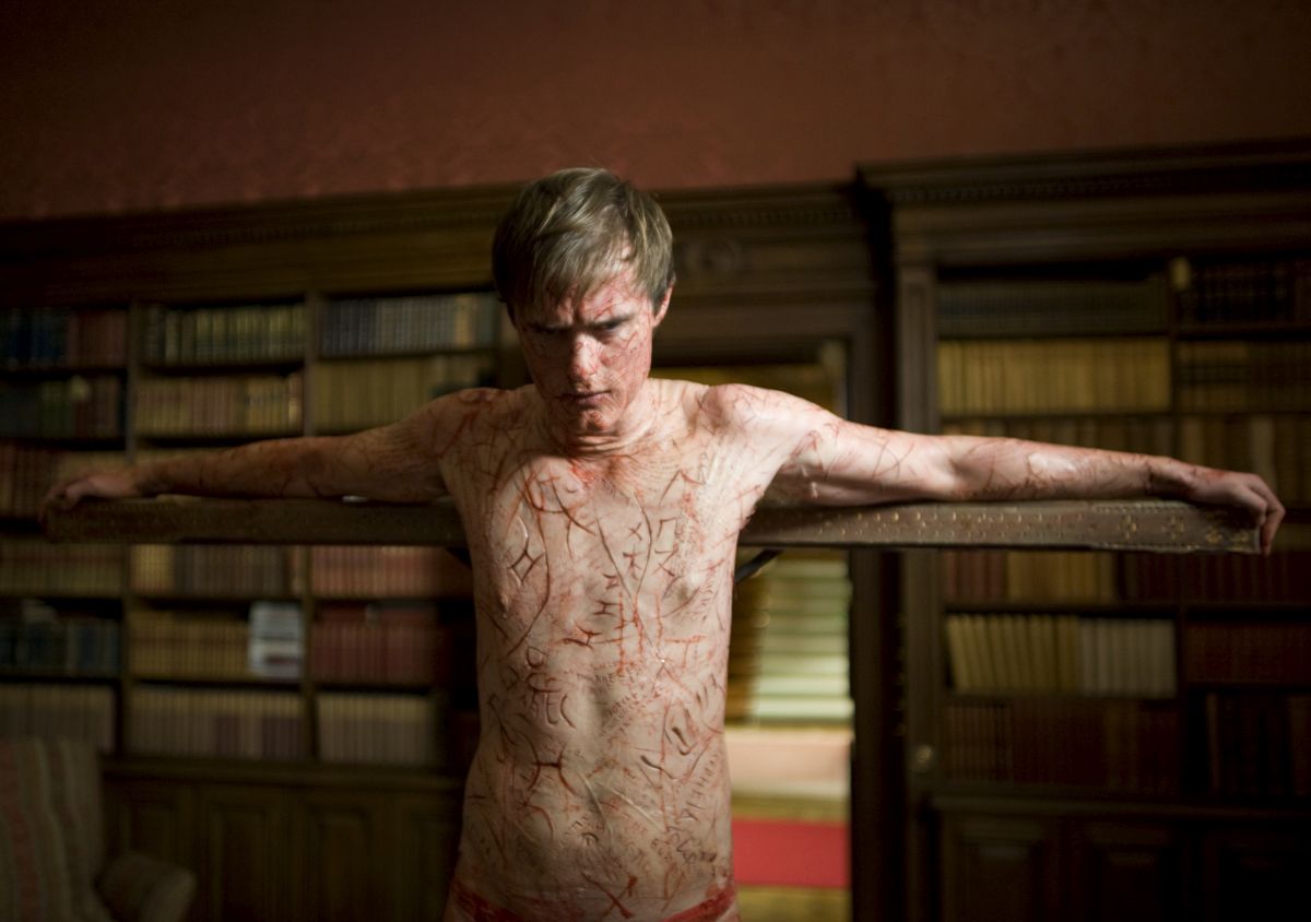 Simon McBeal (Jonas Armstrong) with his skin carved with the stories of the dead in Book of Blood (2009)