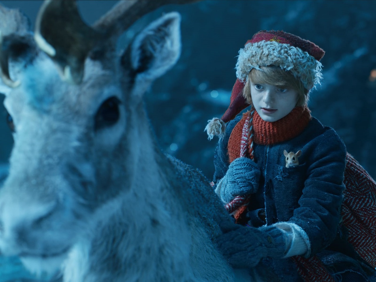Nickolas (Henry Lawfull) and reindeer in A Boy Called Christmas (2021)