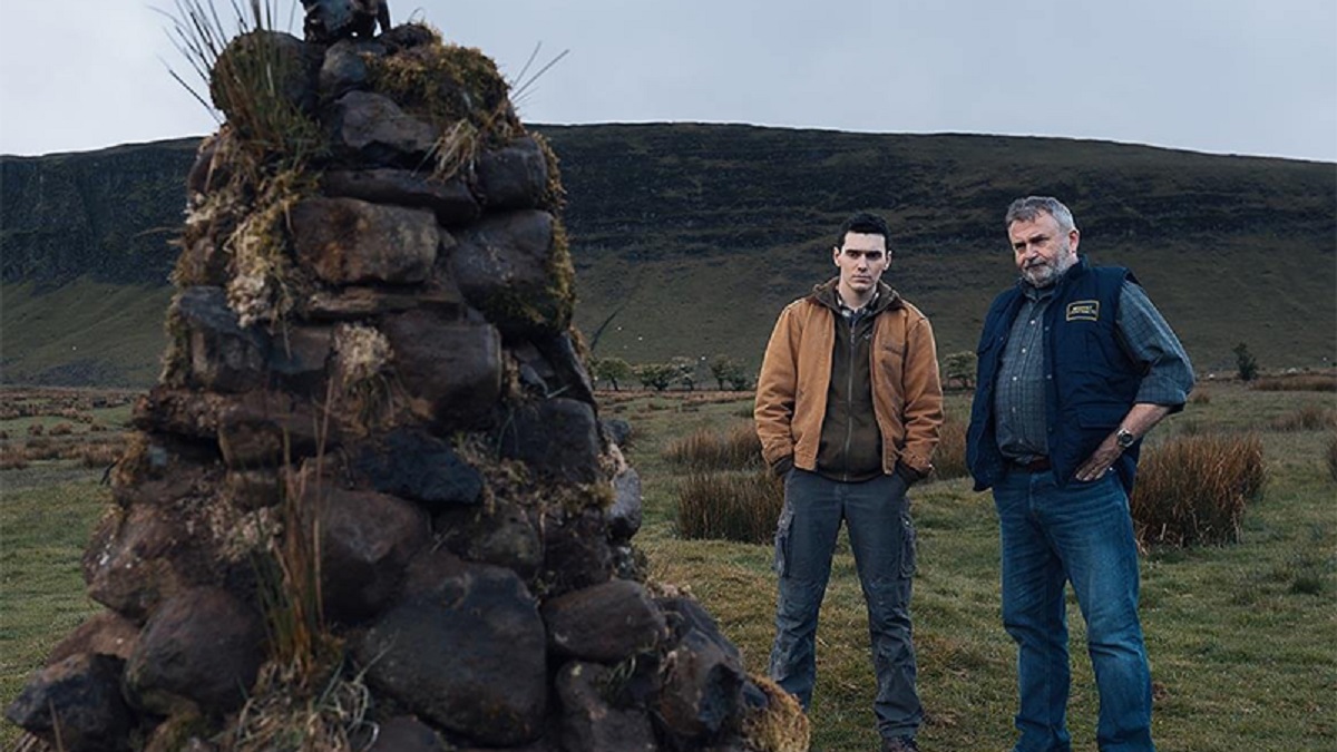 Jack Rowan and Nigel O’Neill stand by the mound of the Abhartach in Boys from County Hell (2020)