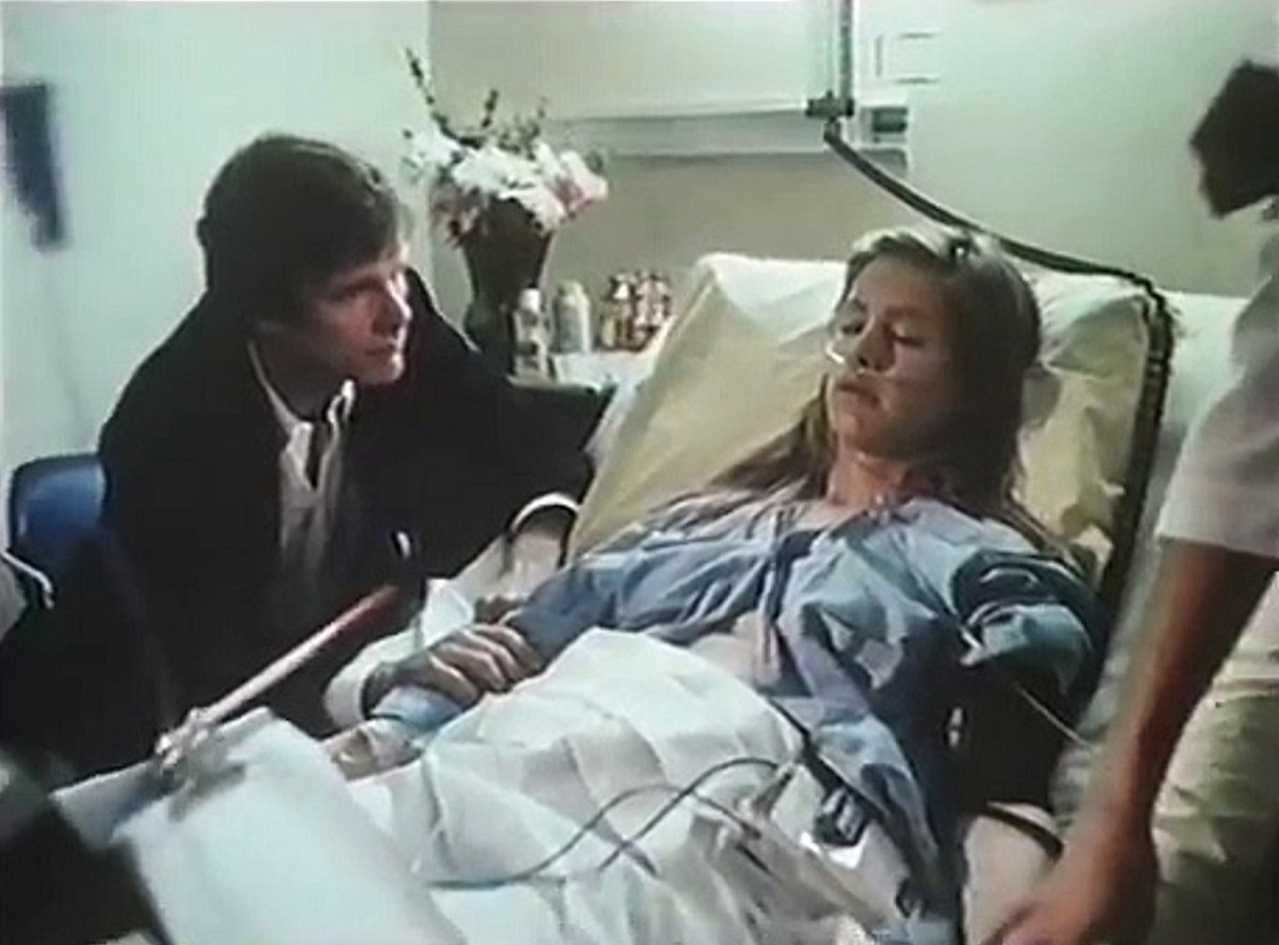 Keir Dullea sits at wife Suzanne Love's hospital bedside in BrainWaves (1982)