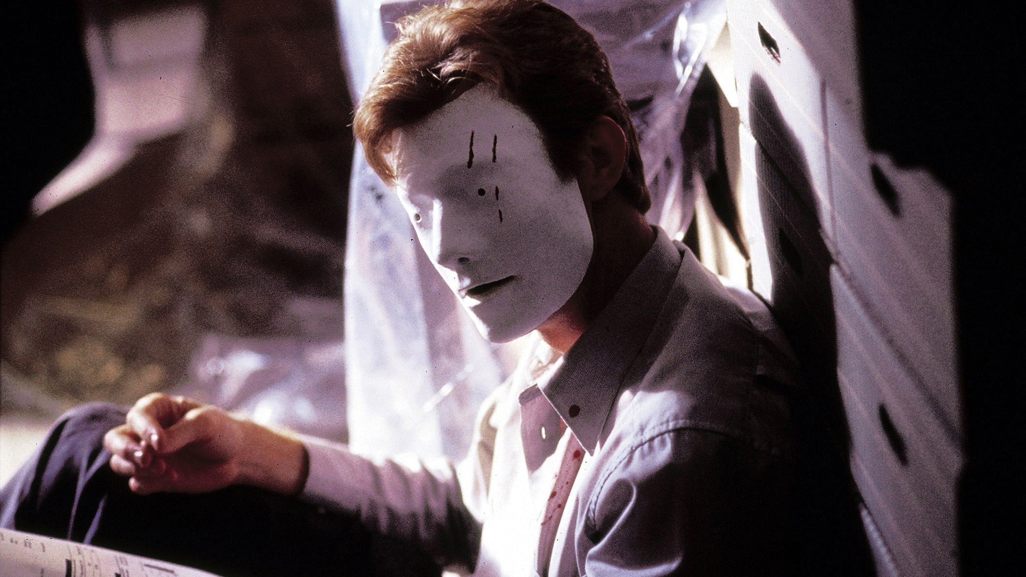 Jason Flemyng wakes up wearing a blank white face mask in Bruiser (2000)