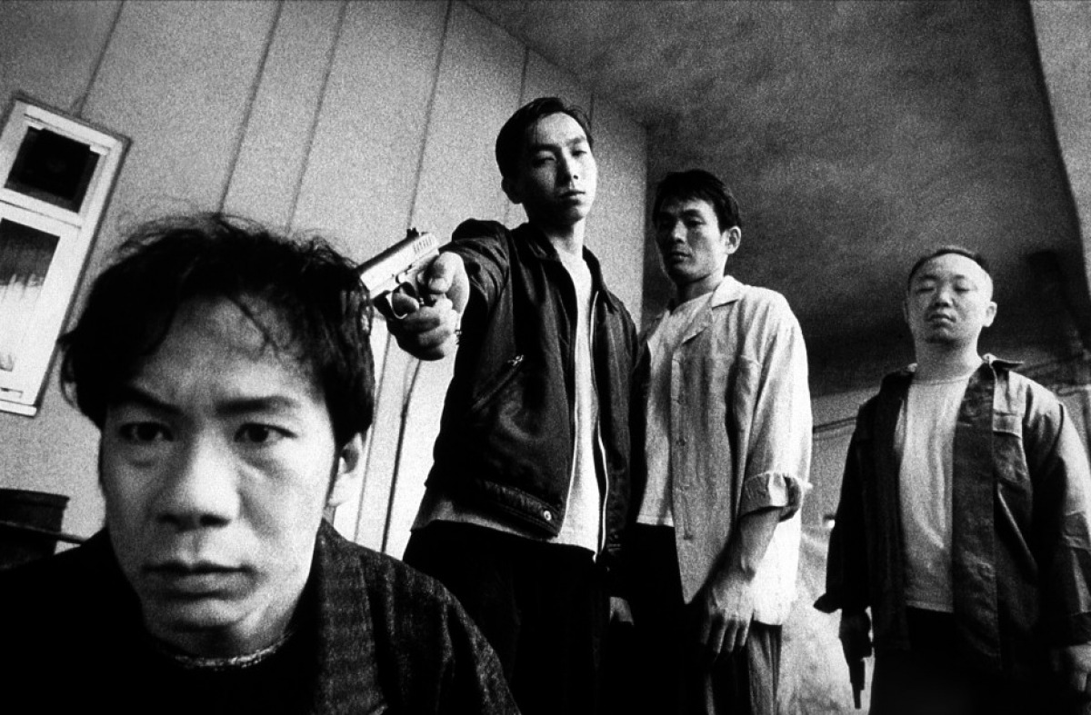 Goda (played by director Shinya Tsukamoto) taunted by gangland members in Bullet Ballet (1998)