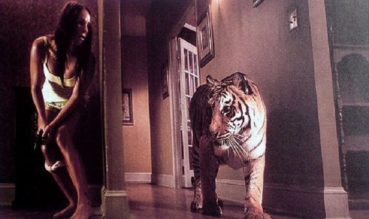 Briana Evigan trapped inside a house with a tiger in Burning Bright (2010)