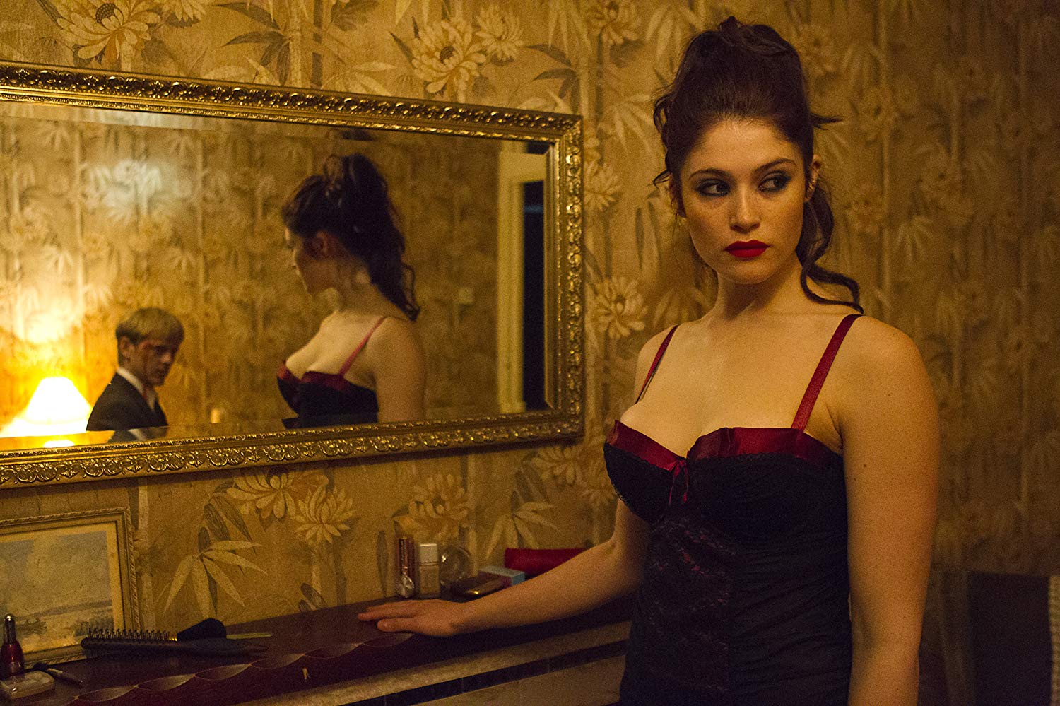 Clara (Gemma Arterton) lures Thure Lindhardt (reflected in mirror) to her apartment in Byzantium (2012)