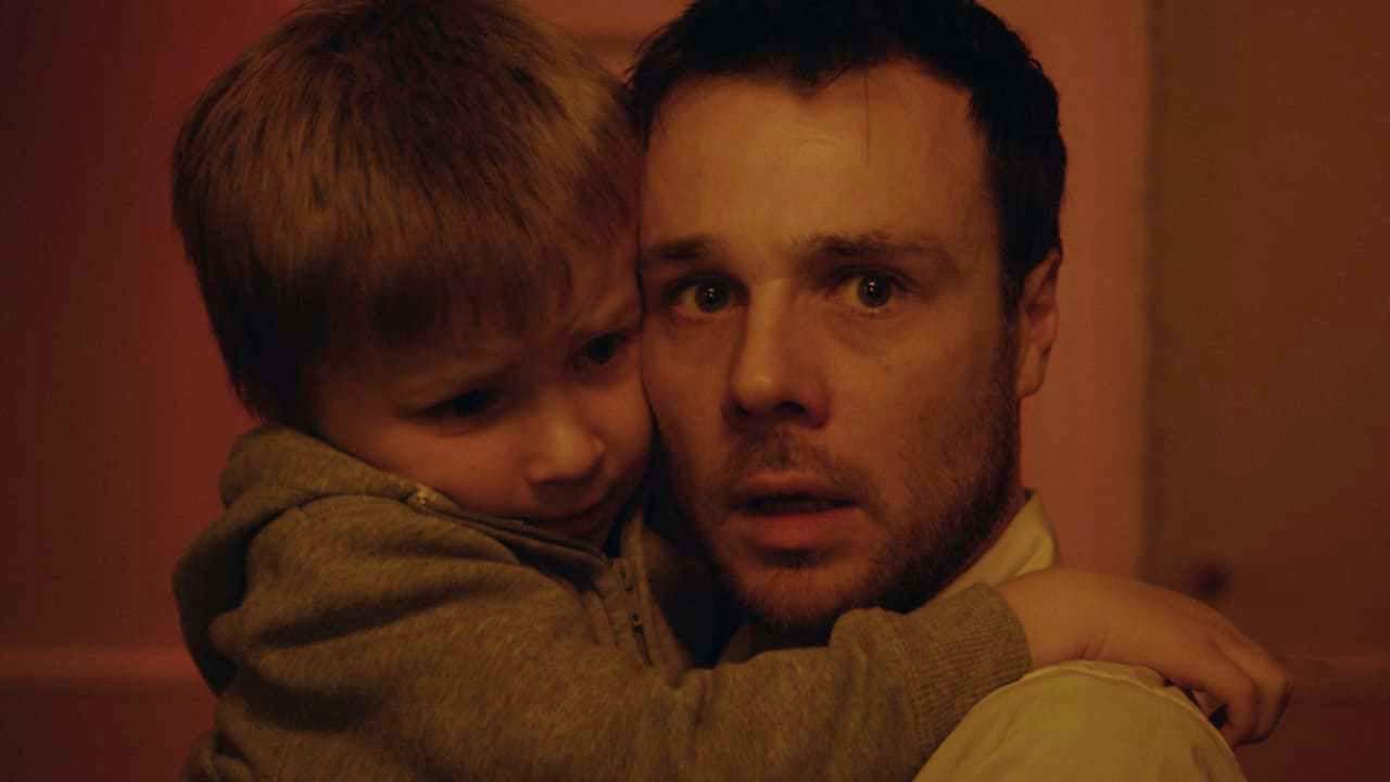 A haunted Rupert Evans and his young son Calum Heath in The Canal (2014)