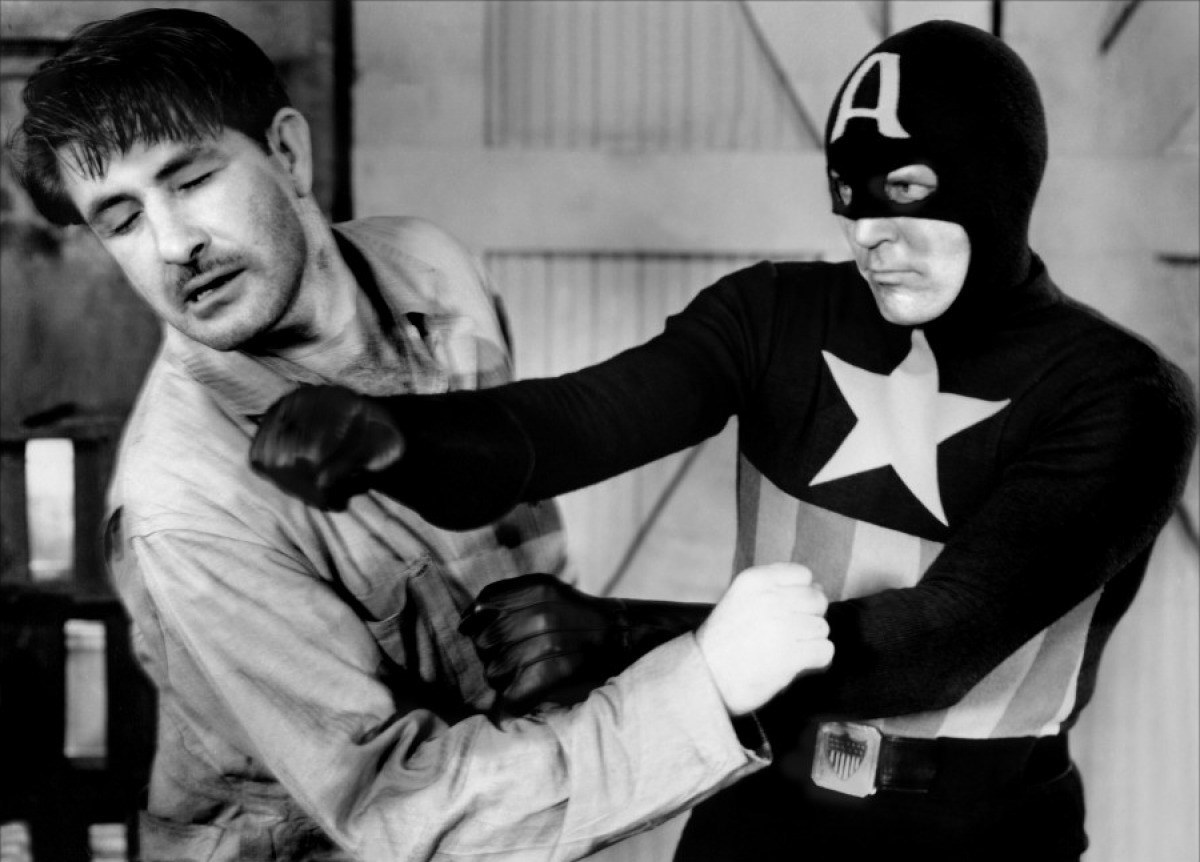 Captain America (Dick Purcell) sorts out an evildoer in Captain America (1944)