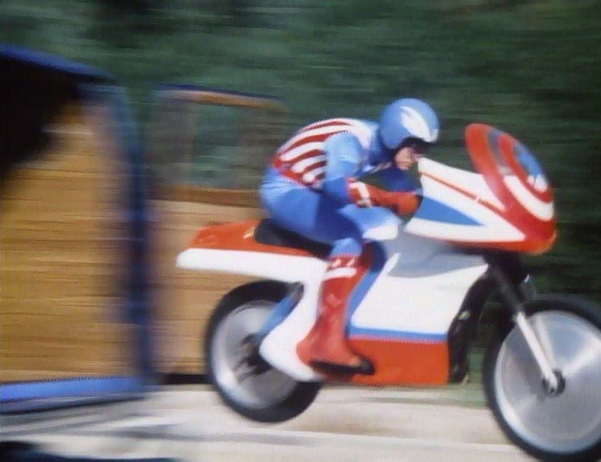 Captain America (Reb Brown) goes into action aboard his motorcycle