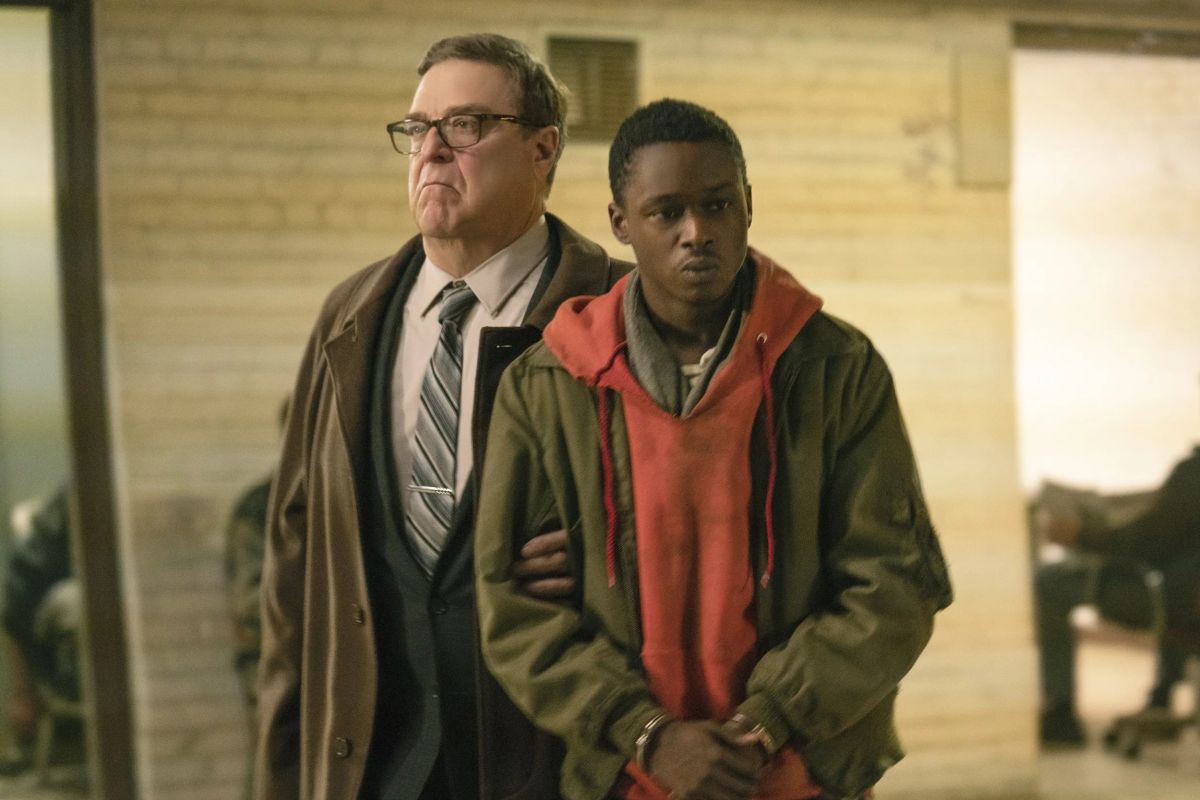 (l to r) District police commander John Goodman and teenager Ashton Sanders drawn into involvement with the resistance in Captive State (2019)