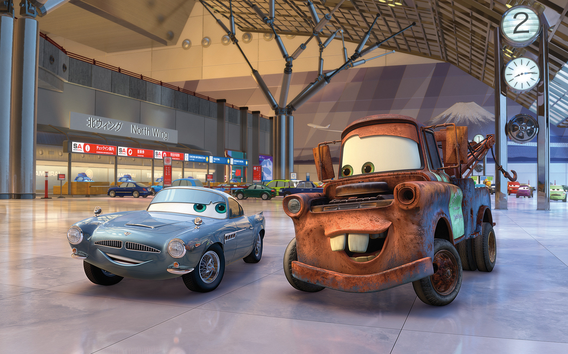 Mater (voiced by Larry the Cable Guy) meets the spy car Finn McMissile (voiced by Michael Caine) in Cars 2 (2011)