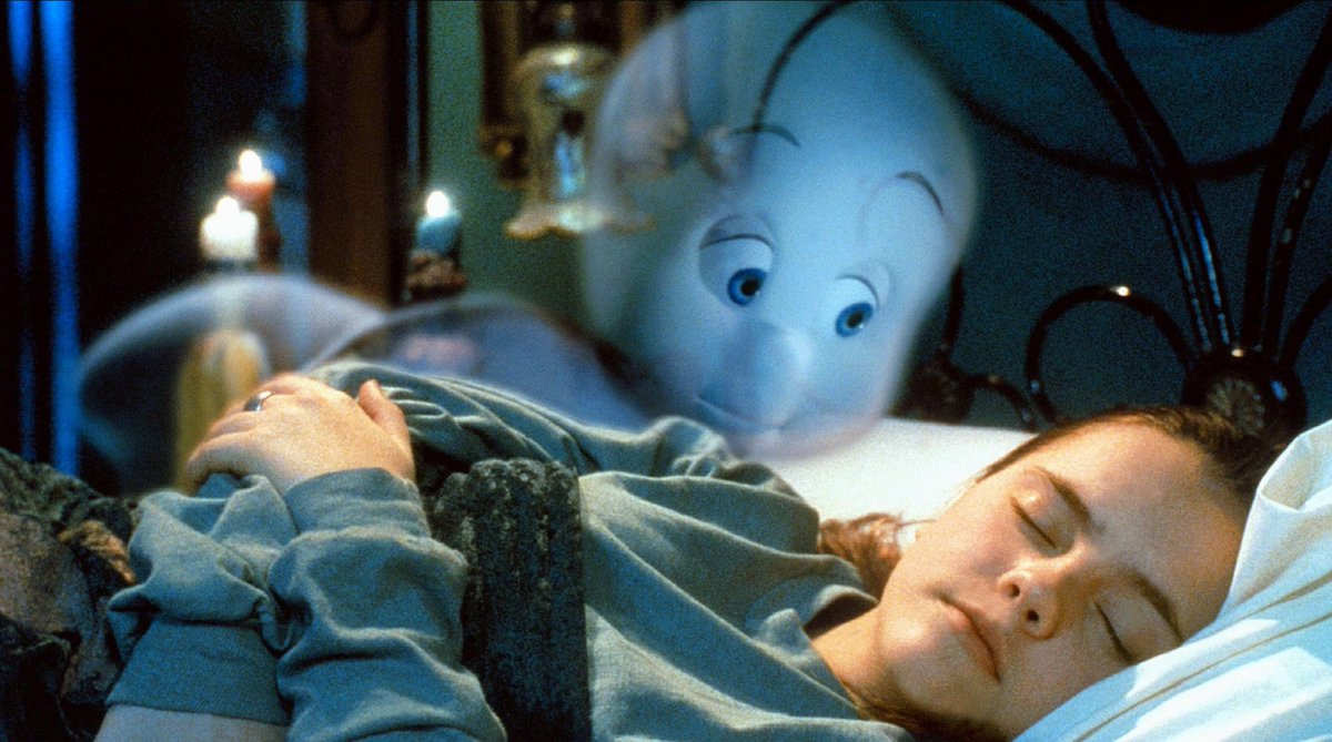 Casper looks over a sleeping Kat Harvey (Christina Ricci) in Casper (1995)