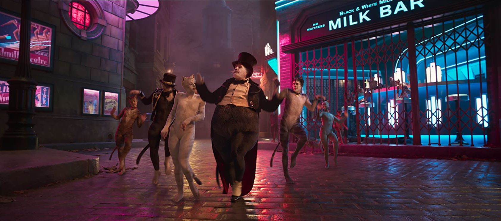 Bustopher Jones (James Corden) leads the Jellicle Cats in Cats (2019)