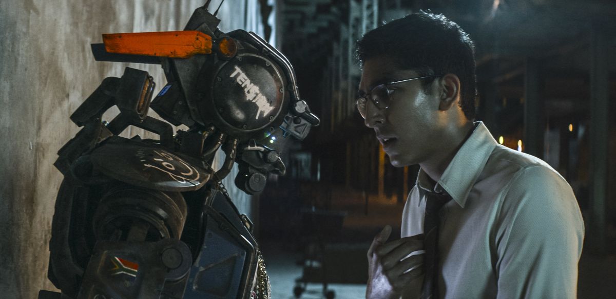 Chappie and creator Dev Patel in Chappie (2015)