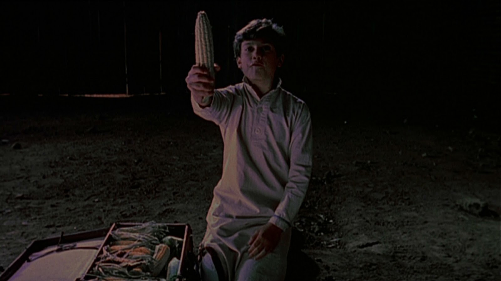 Eli (Daniel Cerny) brings corn from Gatlin with him in Children of the Corn III: Urban Harvest (1995)