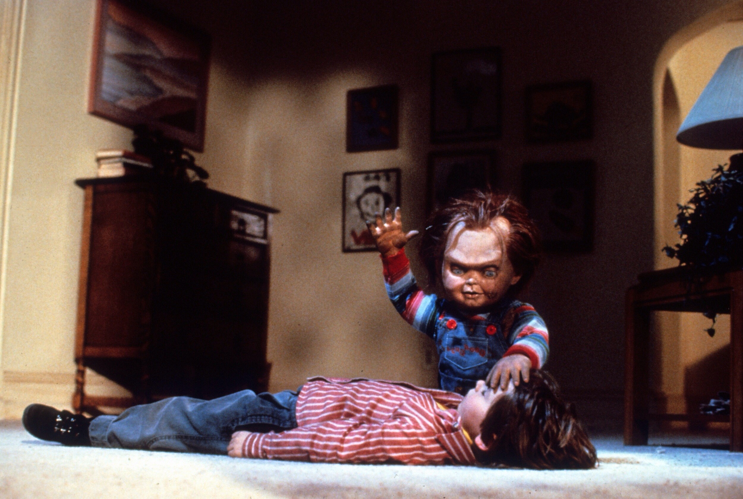 Chucky prepares to sacrifice Andy (Alex Vincent) in Child's Play (1988)