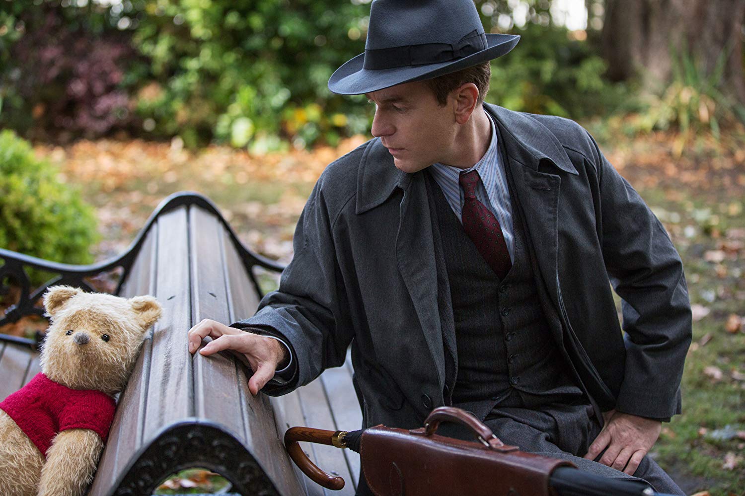 A grown-up Christopher Robin (Ewan McGregor) reconnects with Winnie the Pooh in Christopher Robin (2018)