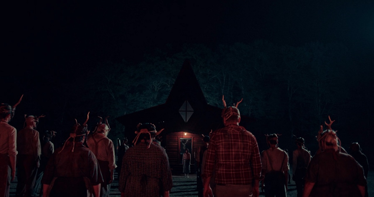 Cultists surround the house in the woods in A Classic Horror Story (2021)