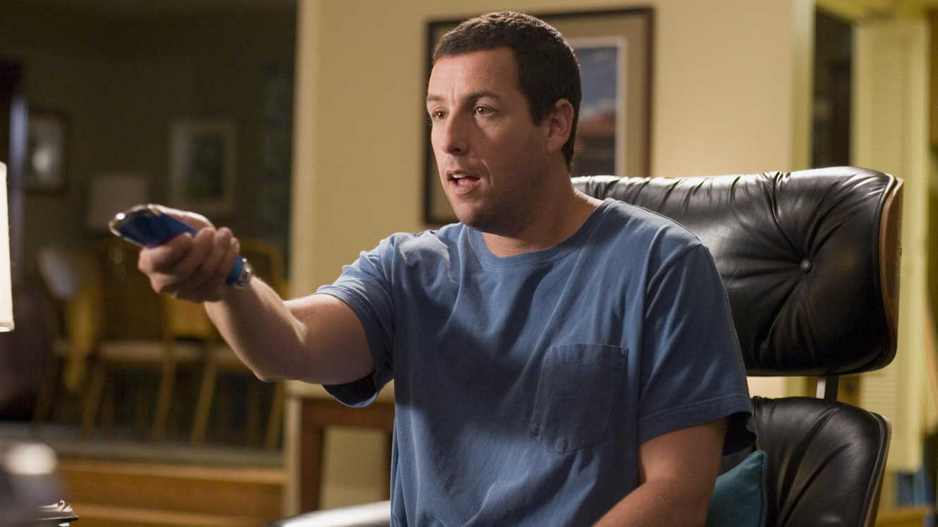 Adam Sandler with the remote control to life in Click (2006)