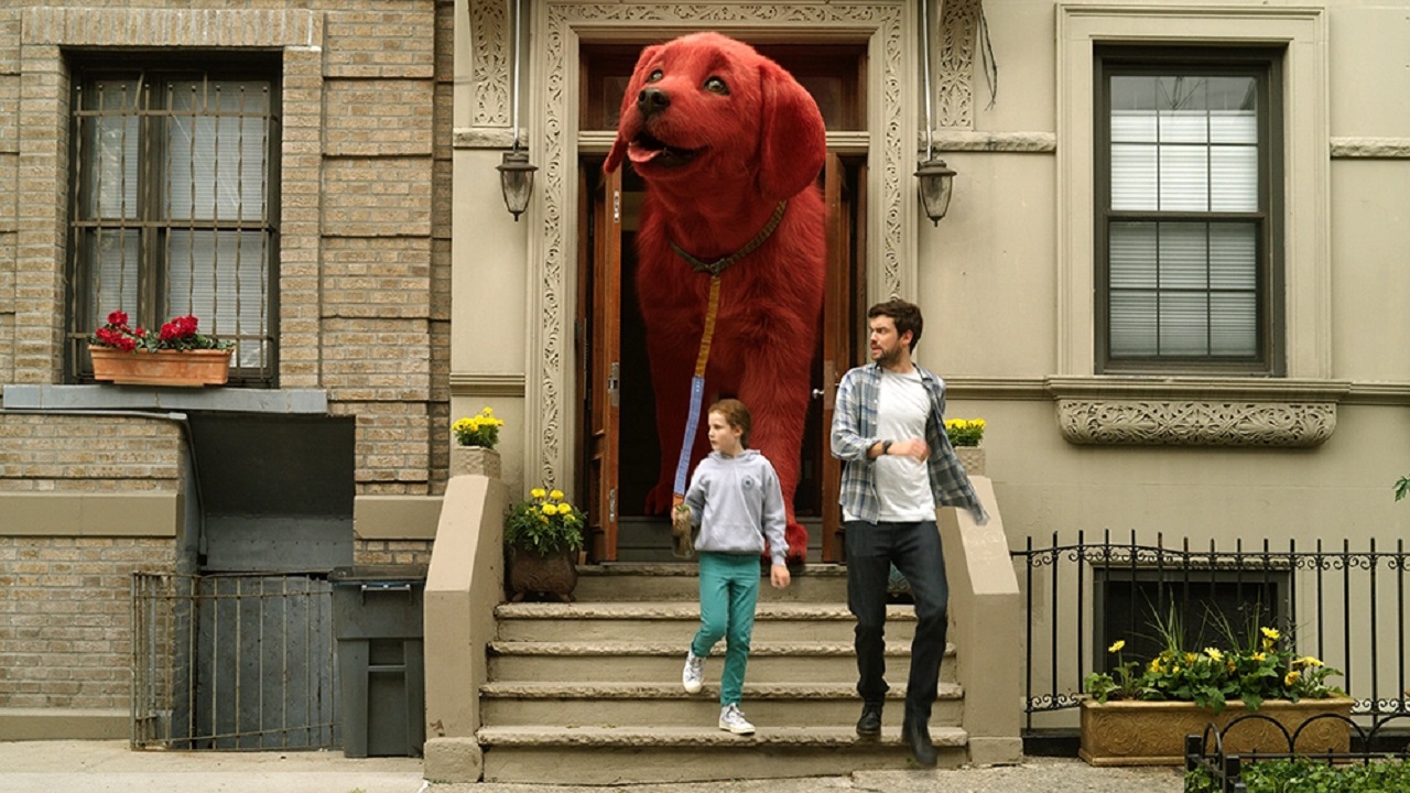 Emily Elizabeth Howard (Darby Camp) and Uncle Casey (Jack Whitehall) take Clifford for a walk in Clifford the Big Red Dog (2021)