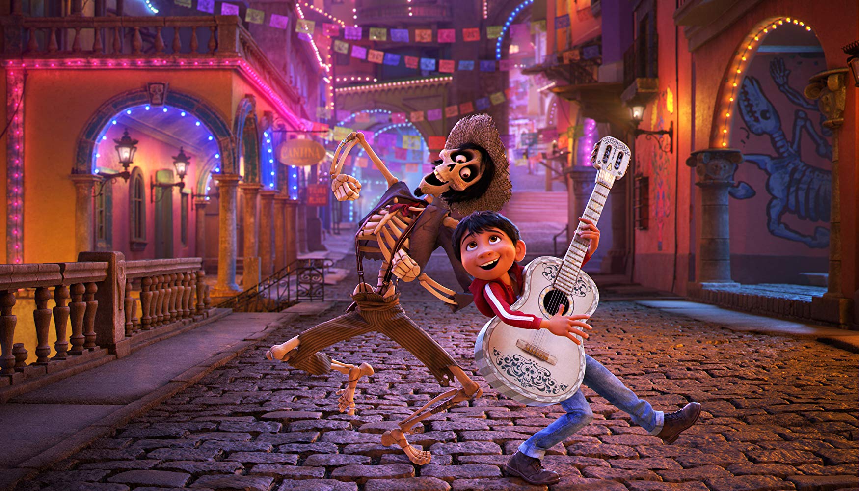 Hector (voiced by Gael Garcia Bernal) and Miguel (voiced by Anthony Gonzalez) sing through the streets in Coco (2017)