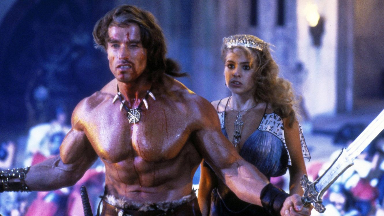 Conan (Arnold Schwarzenegger) assigned with protecting the Princess Jehnna (Olivia D’Abo) in Conan the Destroyer (1984)