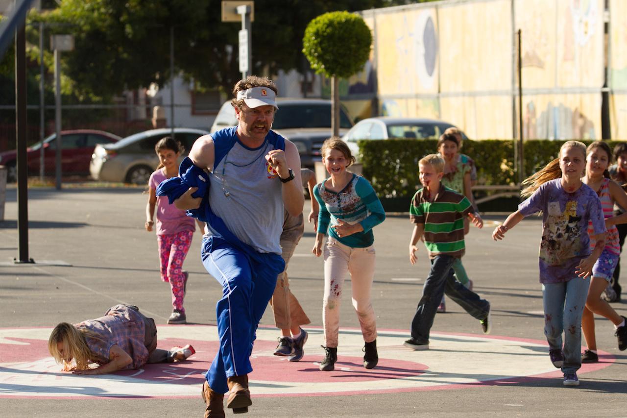 Rainn Wilson pursued by zombie children in Cooties (2014)