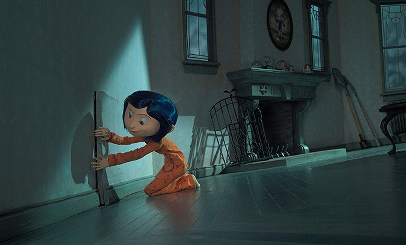 Coraline finds a mysterious door in the wall in Coraline (2009)