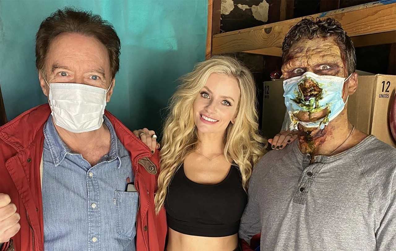 Director Charles Band, Barbie (Cody Renee Cameron) and the Corona Zombie (Russell Coker) in Corona Zombies (2020) 