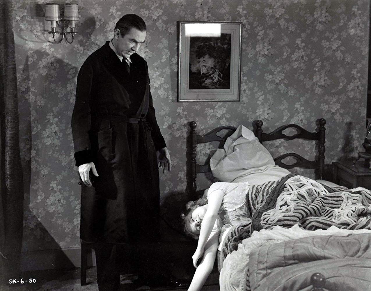 Dr Lorenz (Bela Lugosi) stands over unconscious wife Elizabeth Russell in The Corpse Vanishes (1942)