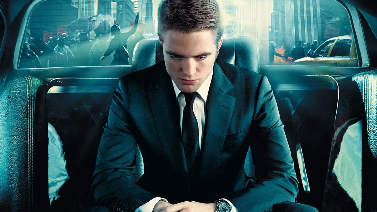 Eric Packer (Robert Pattinson) drifts through a collapsing world in his limousine in Cosmopolis (2012)