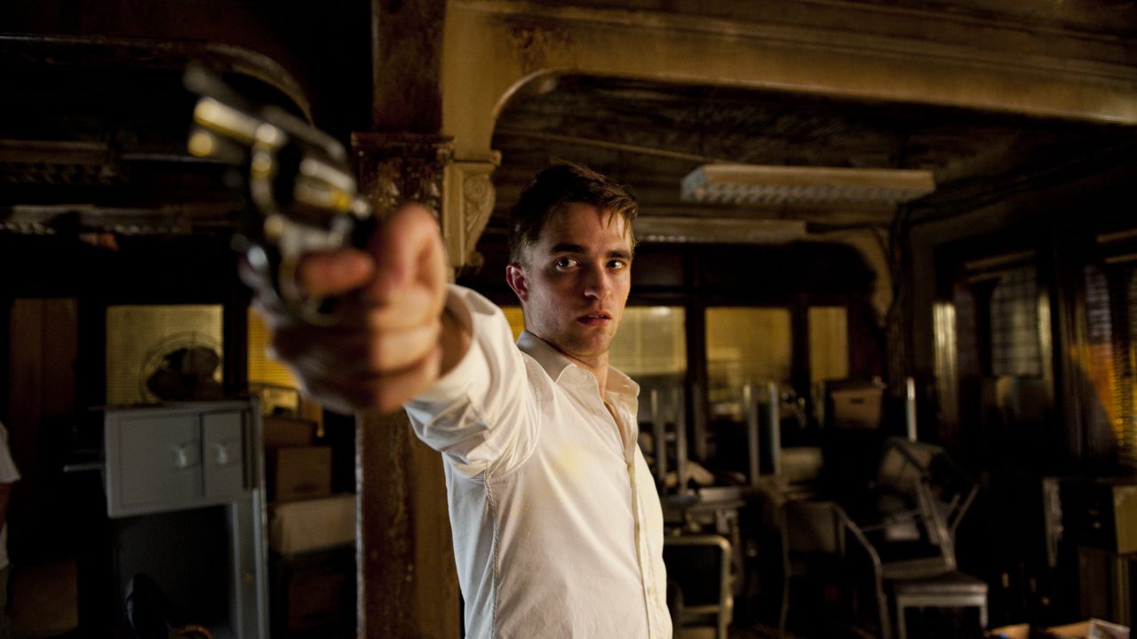 Robert Pattinson with handgun in Cosmopolis (2012)