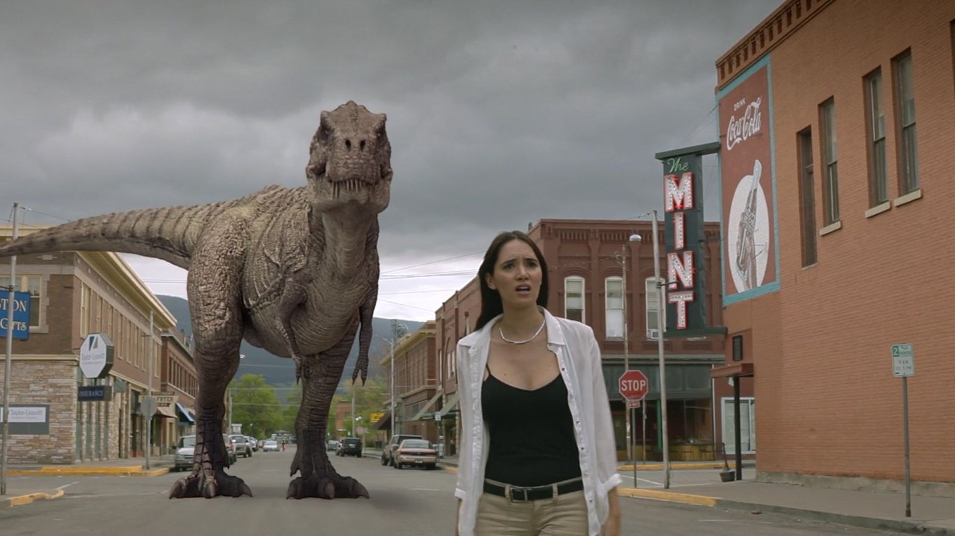 Sara Malakul Lane and dinosaur in Cowboys vs. Dinosaurs (2015)