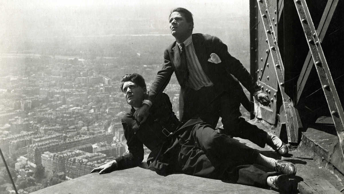 Henri Rollan and Albert Prejean stop the Eiffel Tower amid a Paris frozen in time in The Crazy Ray (1925)
