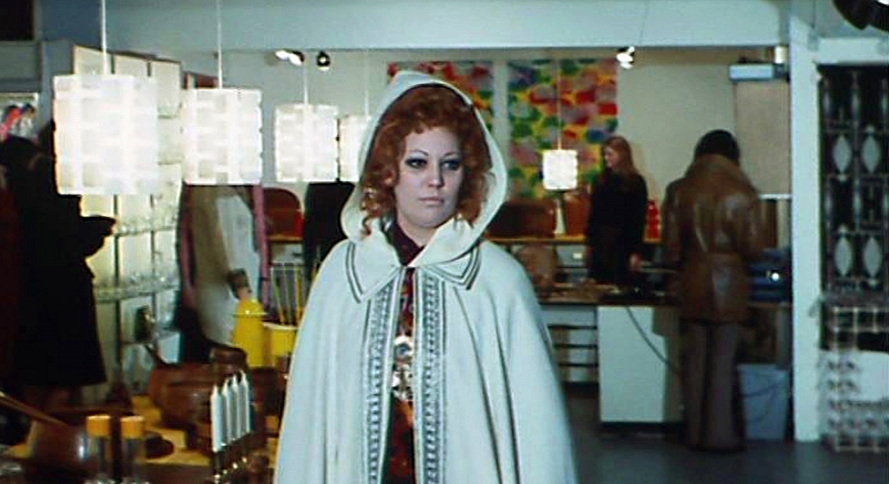 Jeannette Len as the mystery woman in the white coat in The Crimes of the Black Cat (1972)